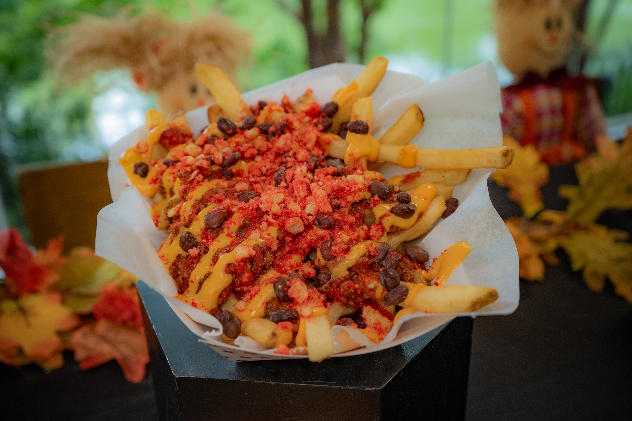 Loaded fries made with chili, nacho cheese, black beans, and Flaming Hot Cheeto dust. Served during Boo at the Zoo at Philadelphia Zoo.