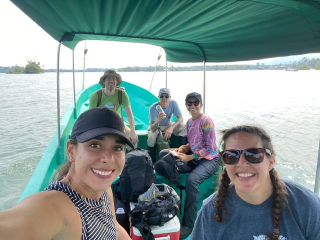 Lauren Augustine, Curator of Reptiles and Amphibians at Philadelphia Zoo, rides in a boat alongside the team she assembled to conduct field research on Guatemalan turtle species.