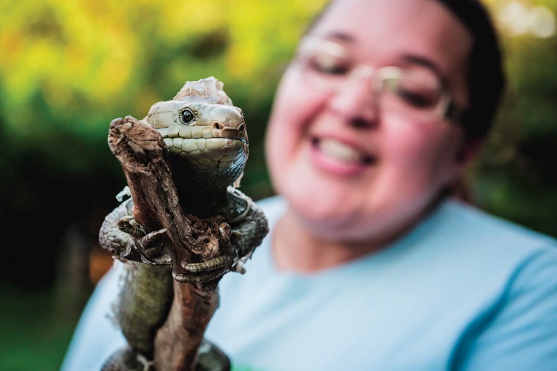 A Philadelphia Zoo staff member displays a reptile on a mobile exhibit.