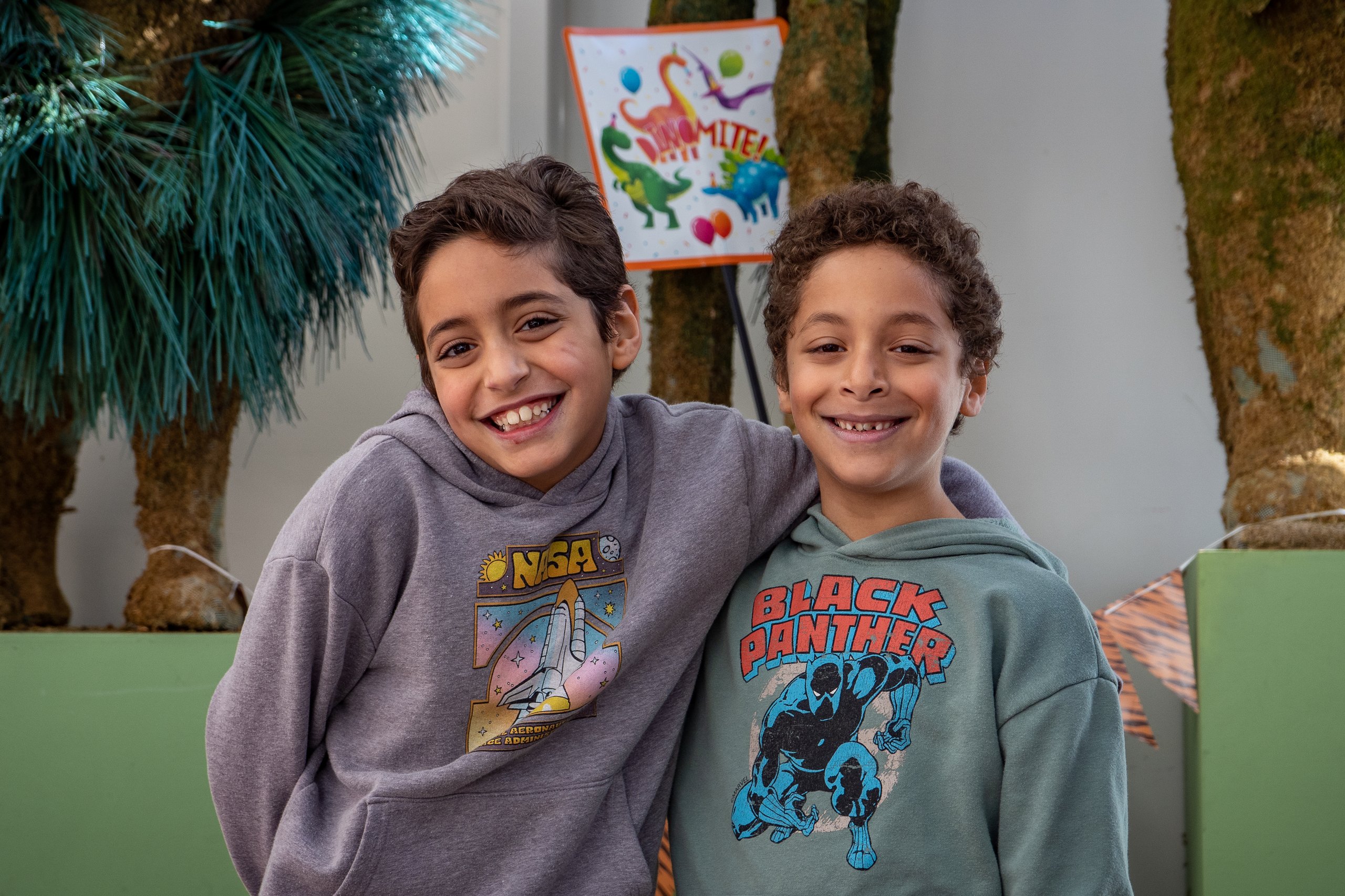 Two young boys pose for a photo during a birthday party at Philadelphia Zoo.