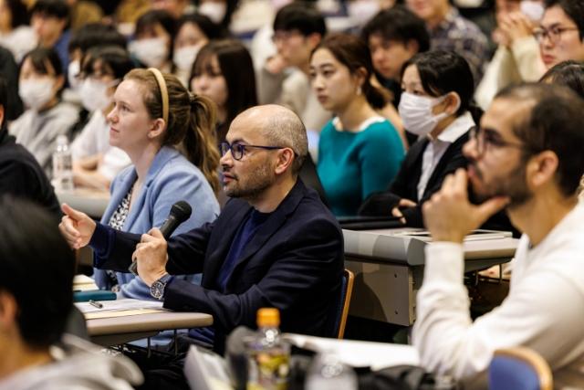 Dr. Hassabis commenting to a speaker