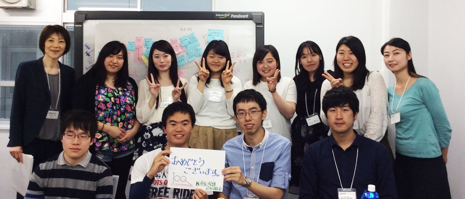 Students and Faculty of the Inter-Professional Education Program holding a message