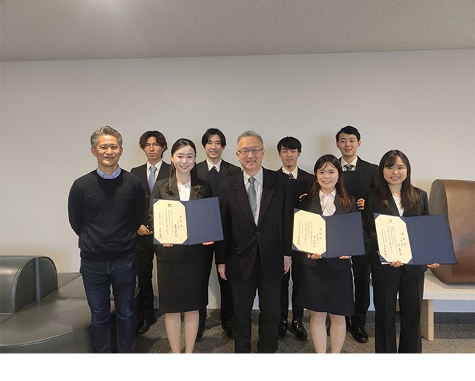 Group photo of students holding their award certificates