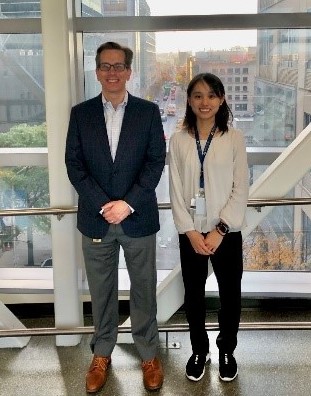 Image of two people standing side by side