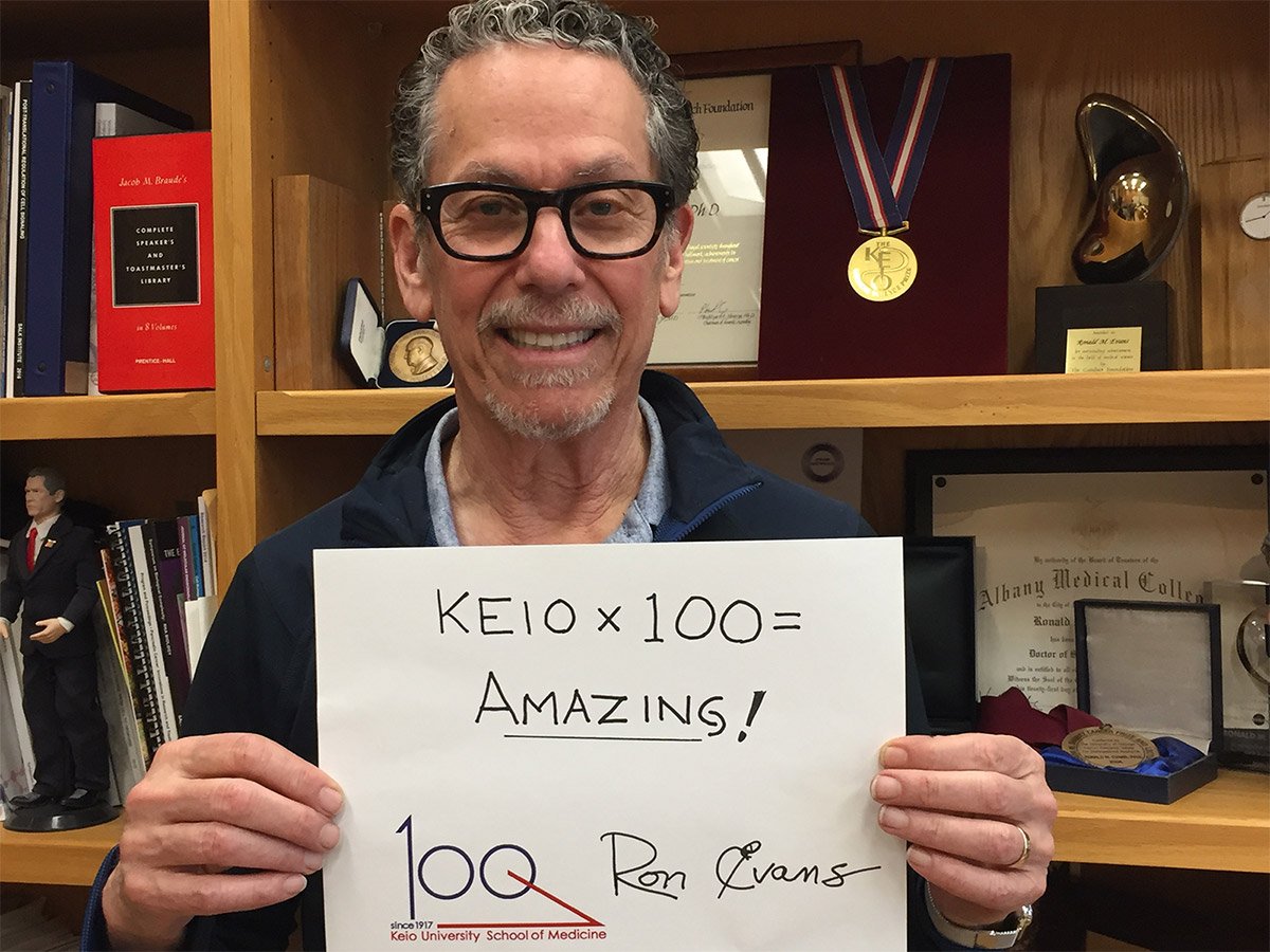 Ronald M. Evans holding a message