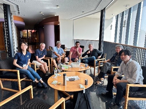 Group photo around a desk