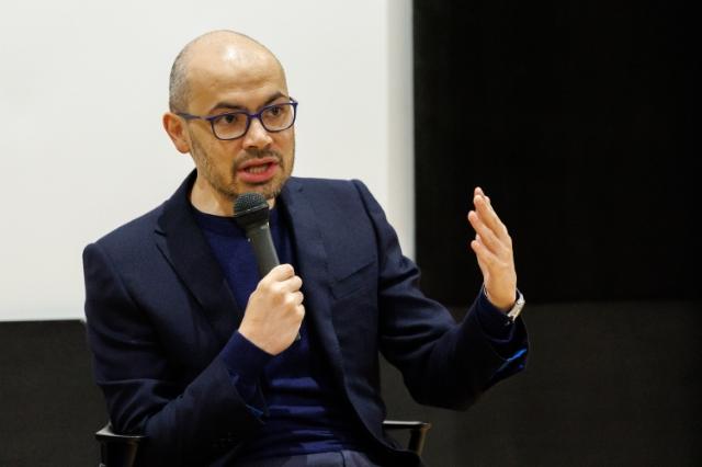 Dr. Hassabis enthusiastically answering a question