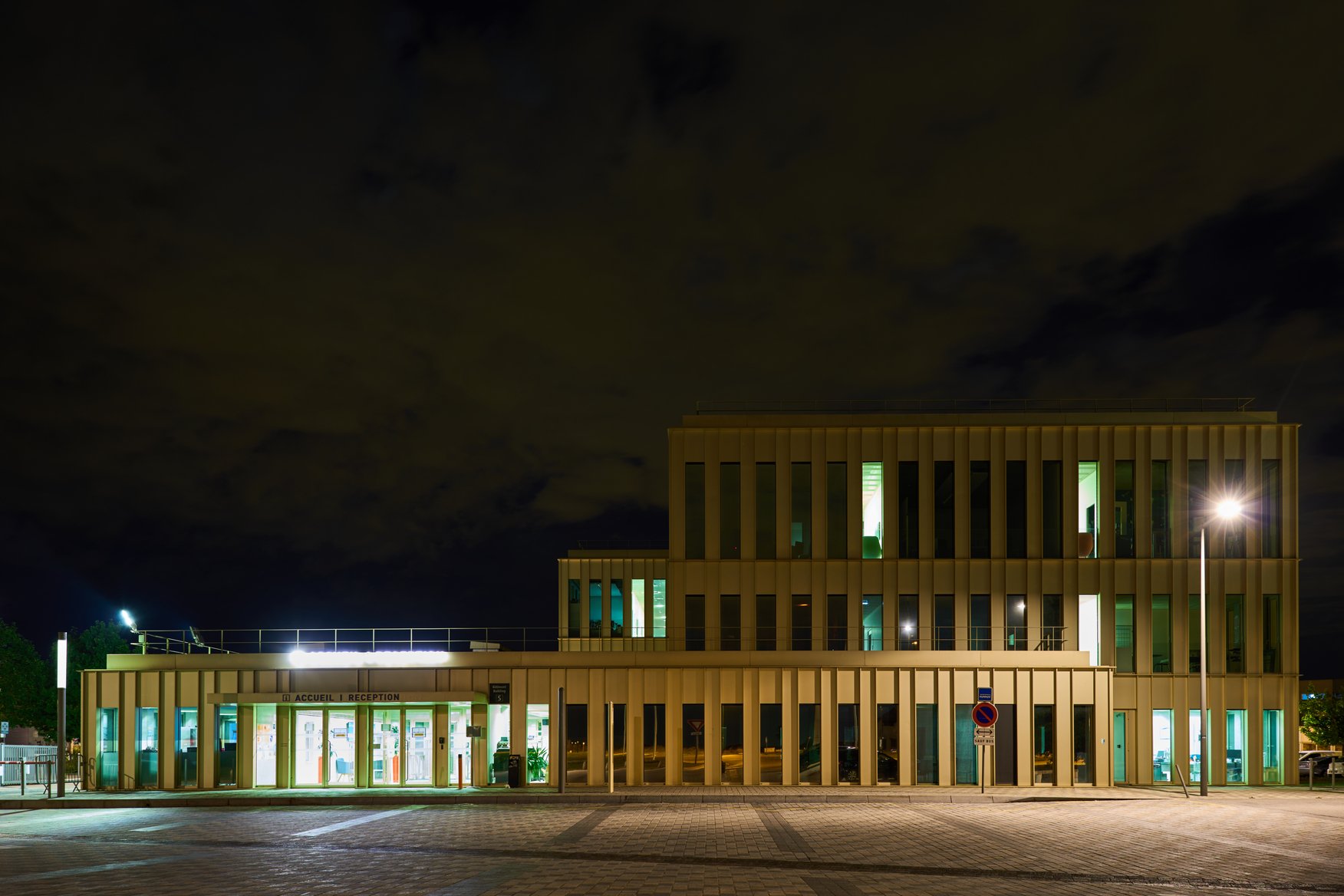 A photo of the campus lit up at night.