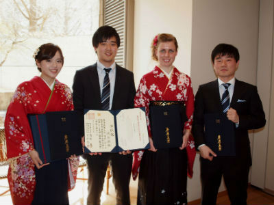 Photo of the graduates attending the reception