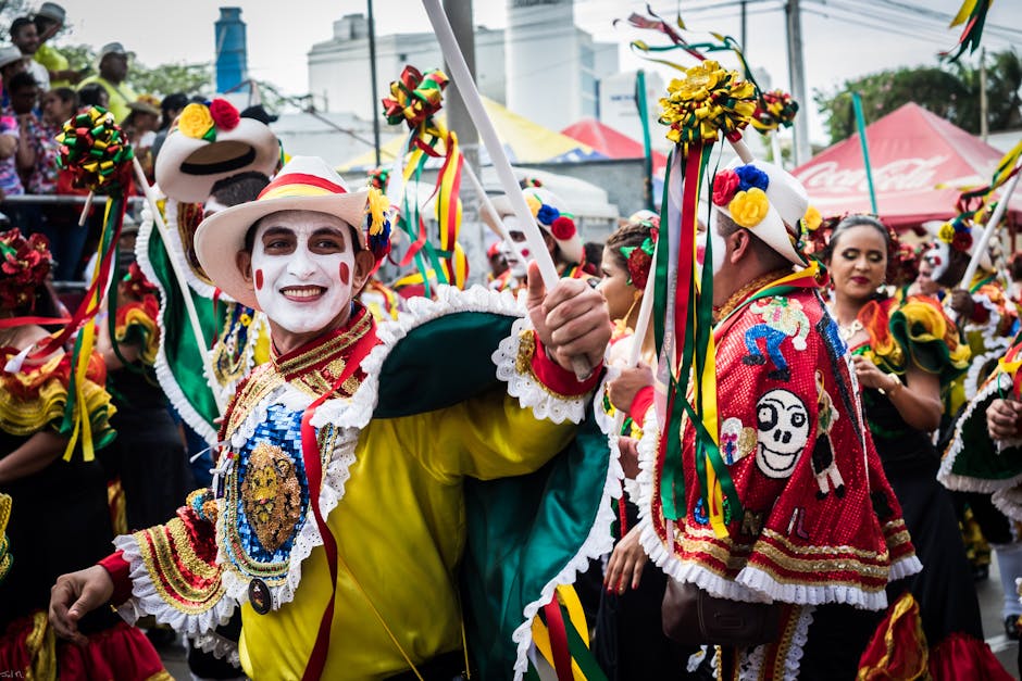 Barranquilla carnival crowd umbrellas rainy street parade Colombia