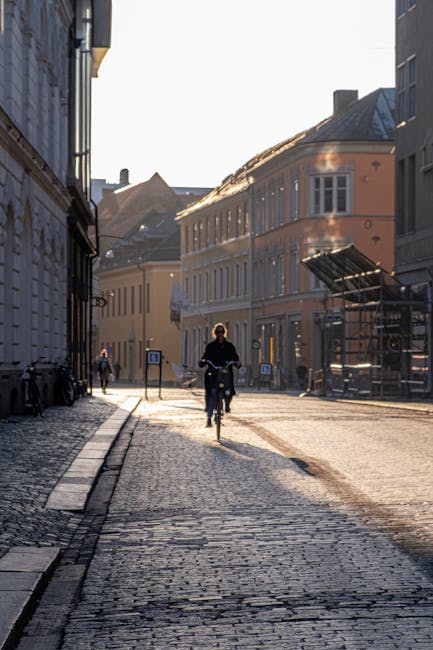 commuter electric bicycle city street morning rider pexels