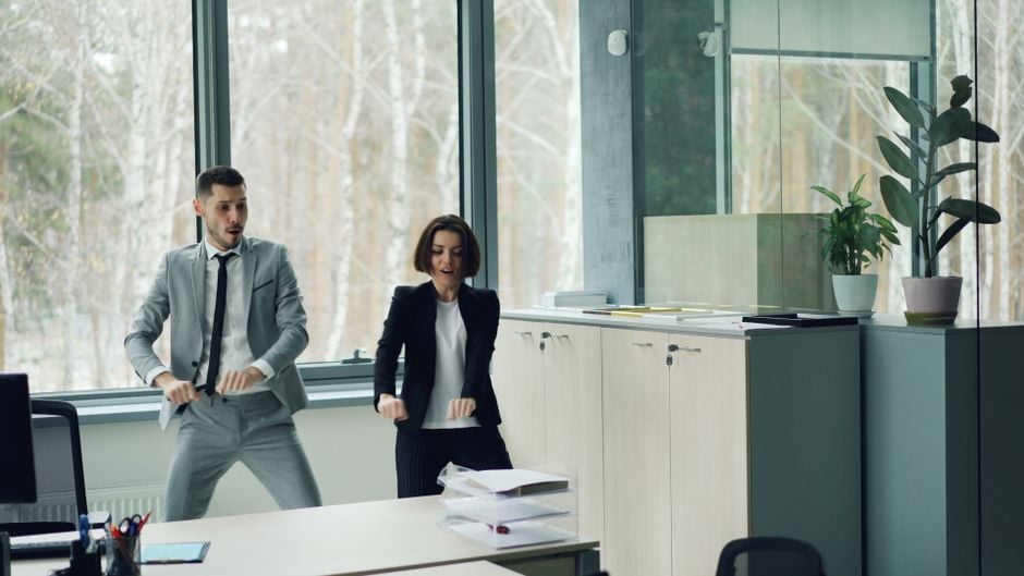 teacher leading five minute dance break classroom office employees short movement break