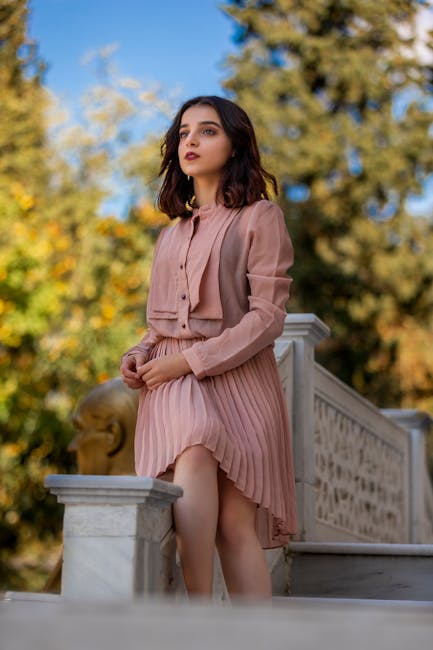 Elegant woman in a pink dress posing outdoors in Istanbul, Türkiye.