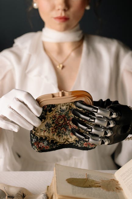 A stylish woman wearing a white blouse uses a prosthetic hand to hold a vintage purse, highlighting elegance and modern technology.