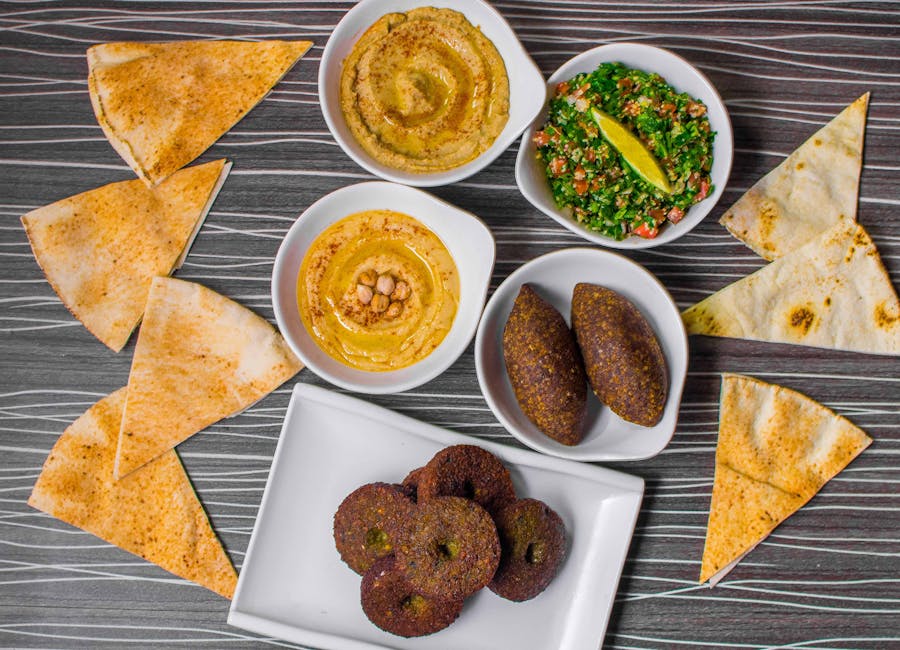 Mediterranean mezze platter falafel kibbeh tahini pomegranate pita