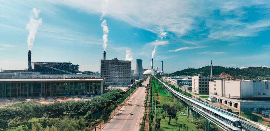 Aerial view of Jiujiang industrial area with factories and smoke stacks.