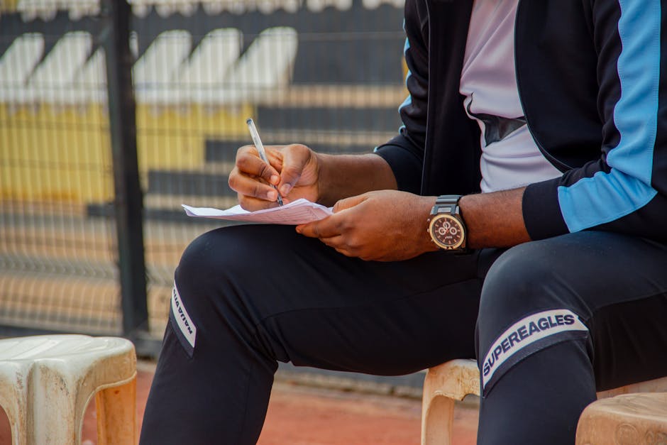national team injury substitution stadium sidelines coach clipboard