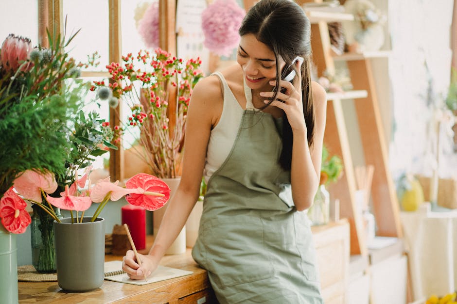 flower shop owner filming reel smartphone bouquet natural light