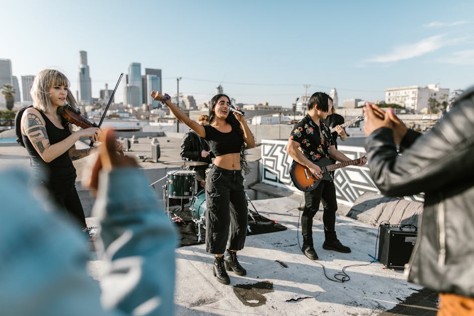 A vibrant rooftop concert with a band playing live music amidst an urban skyline backdrop.