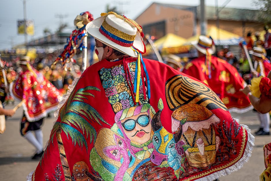 Vibrant festival scene featuring traditional Colombian dancers in colorful costumes with hats and capes.