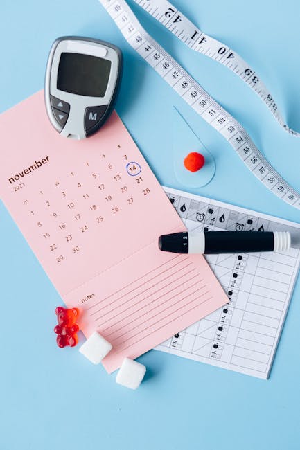 Flat lay of diabetes awareness tools on a blue backdrop with calendar.