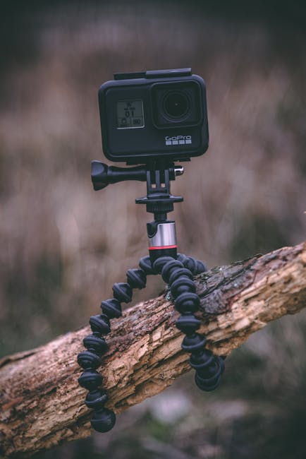 portable AI sports camera on tripod field