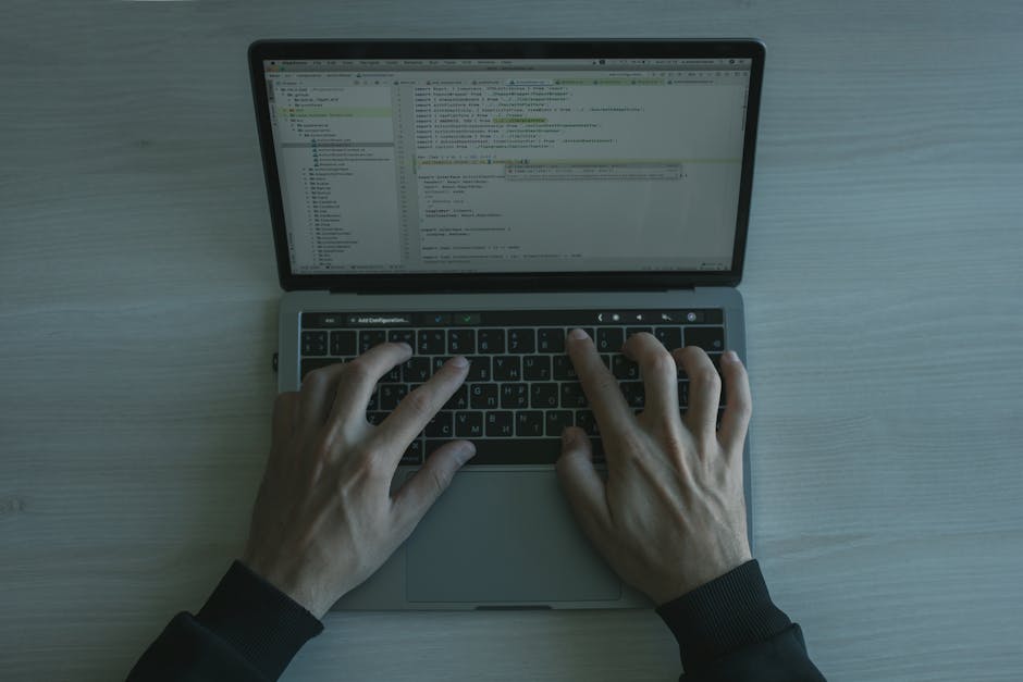 SvelteKit code on laptop developer typing TypeScript