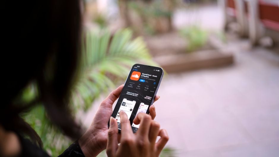 confused user holding smartphone looking at app subscription screen