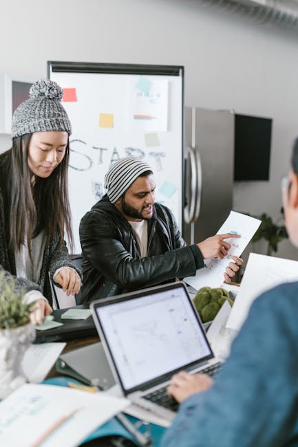 female entrepreneur pitch deck laptop investors meeting, professional, diverse team