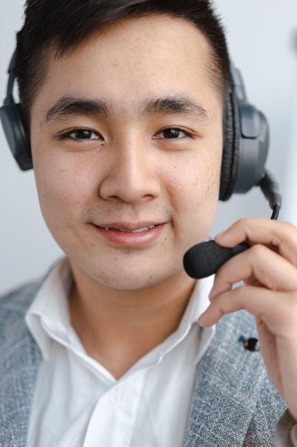 call center agent headset verifying caller phone fraud