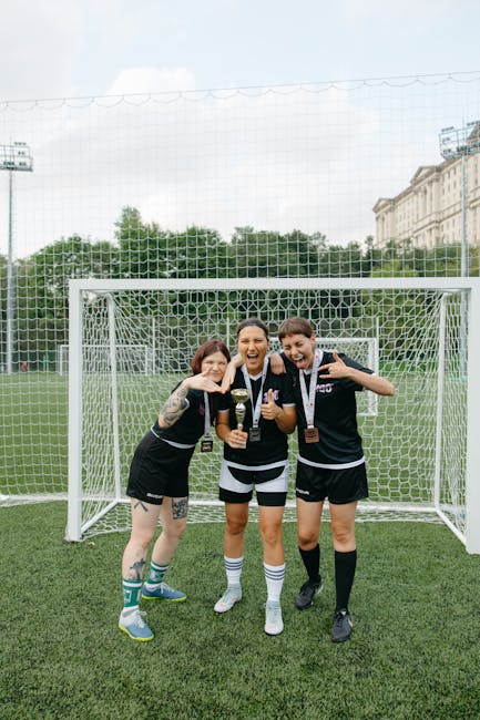 women's soccer players celebrating with fans pitchside activation family zone
