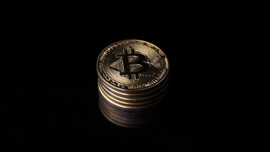 Close-up of stacked Bitcoin coins representing cryptocurrency and finance concepts.