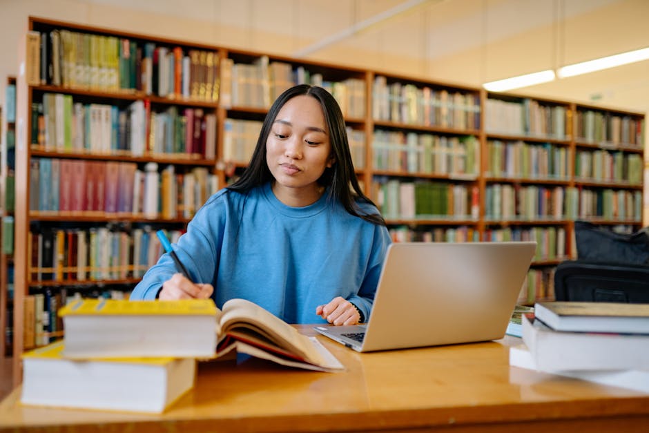 Nepali students library studying laptop scholarship application documents