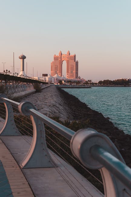 Captivating view of Abu Dhabi's iconic architecture during sunset by the waterfront.