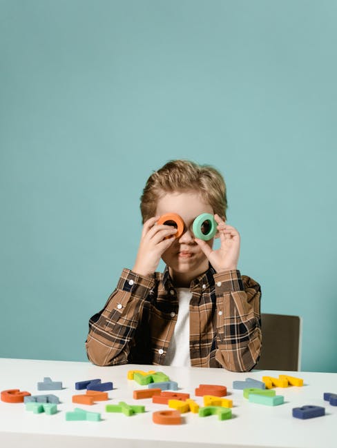 A young child enjoying alphabet block play, exploring creativity and learning indoors.
