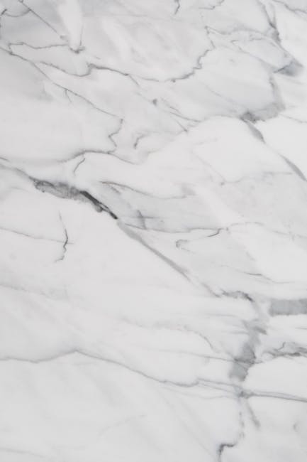 Close-up of elegant white marble texture with gray veining, perfect for design and decoration concepts.