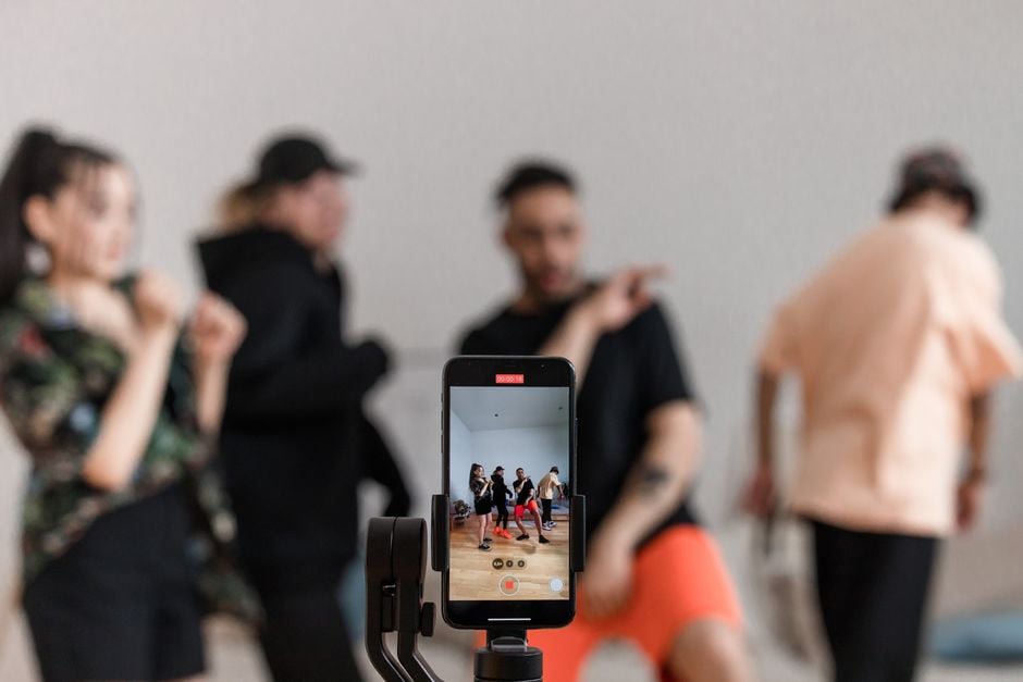 dance instructor filming short choreography tutorial smartphone studio
