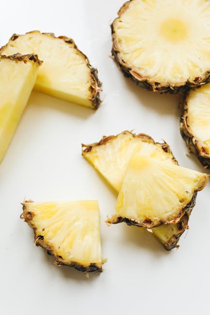 Close-up of juicy pineapple slices showing texture and vibrant yellow color.