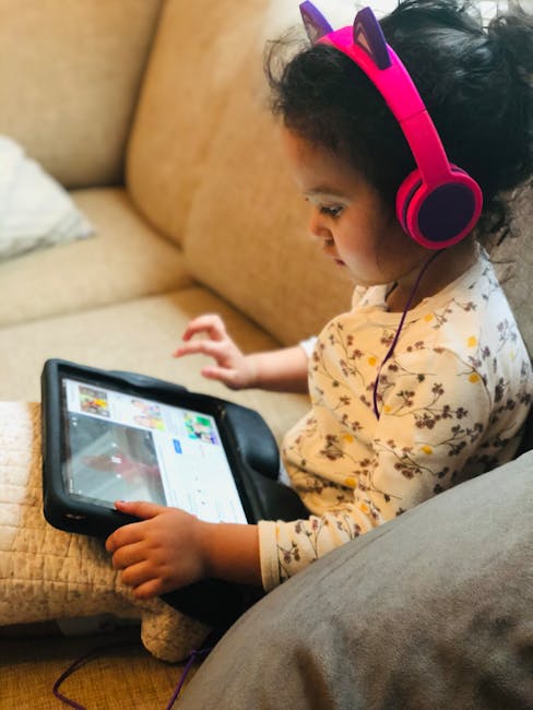 parent and toddler tablet learning app at home smiling
