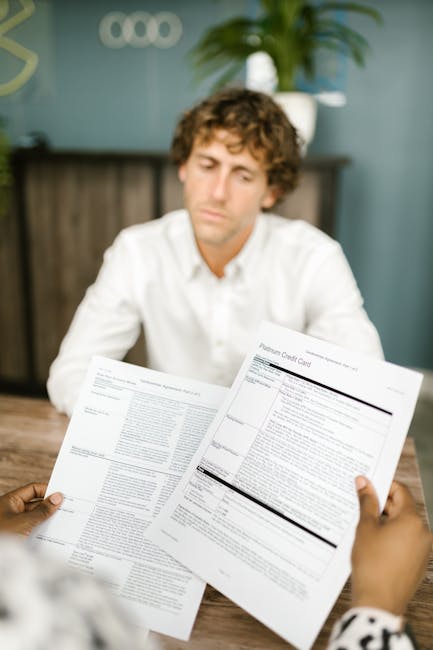 employee reviewing bank statement paycheck smartphone office