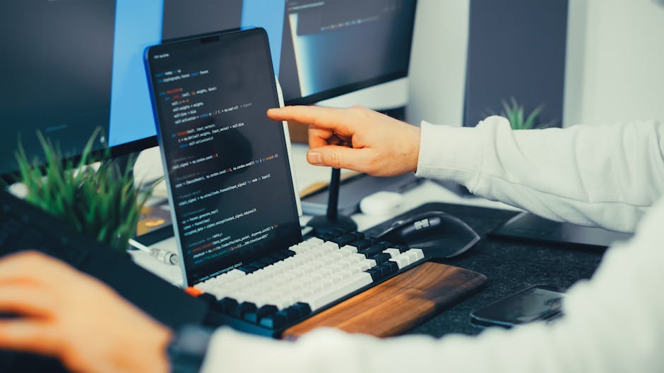 developer reviewing package registry code monitors cybersecurity