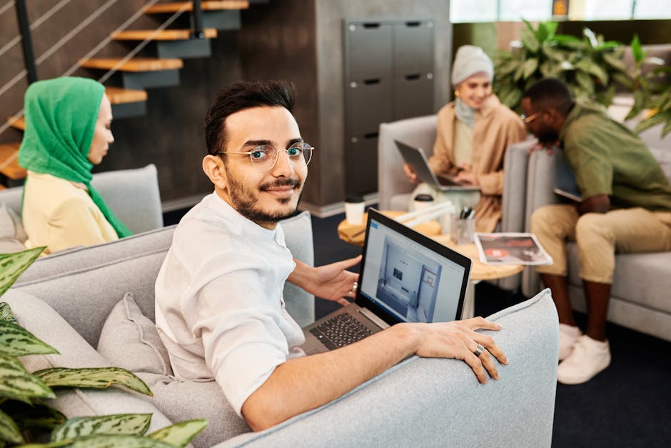 startup team meeting Dubai office entrepreneur laptop