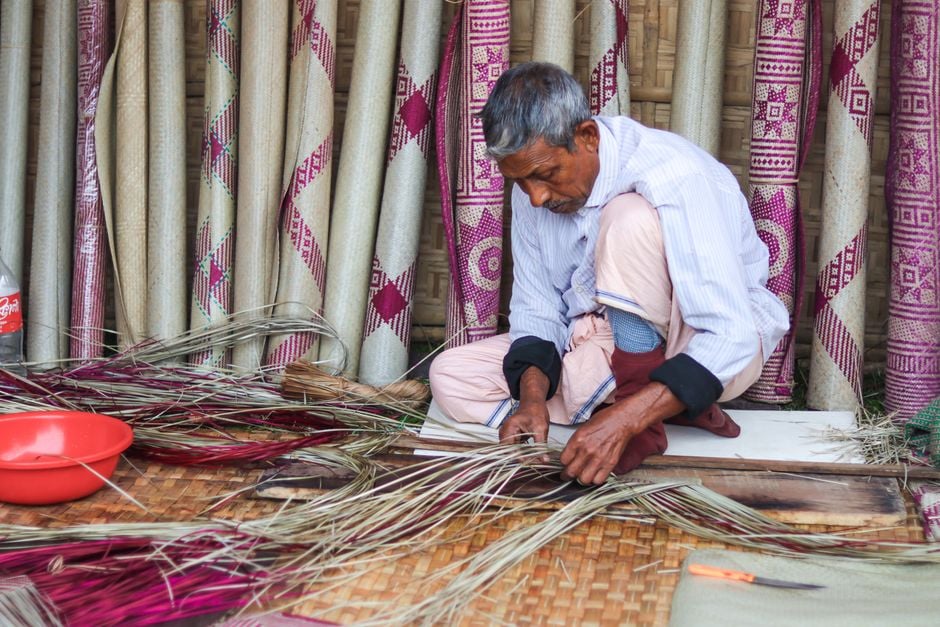Nepali artisans weaving traditional textiles Dhaka top view workshop market Nepal