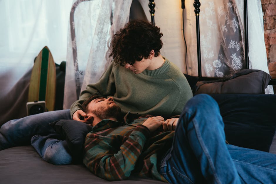 A loving couple relaxes together in a cozy indoor setting, embodying warmth and connection.