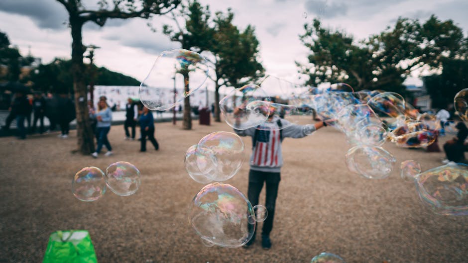 People enjoying bubbles in an Amsterdam park. Captures joy and leisure outdoors.