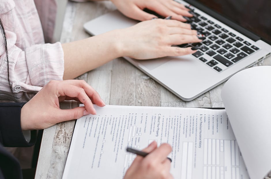 business team reviewing insurance contract laptop cybersecurity