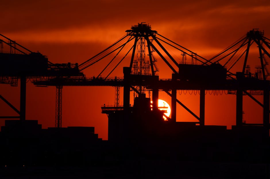 Arab port container ship cranes sunset carbon emissions port