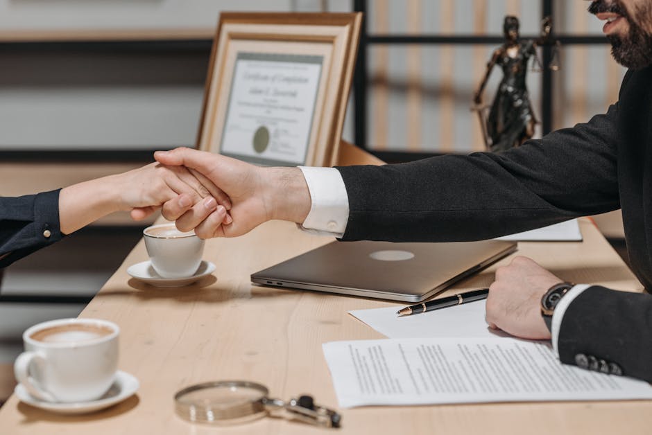 Gulf legal contract signing office handshake Arabic