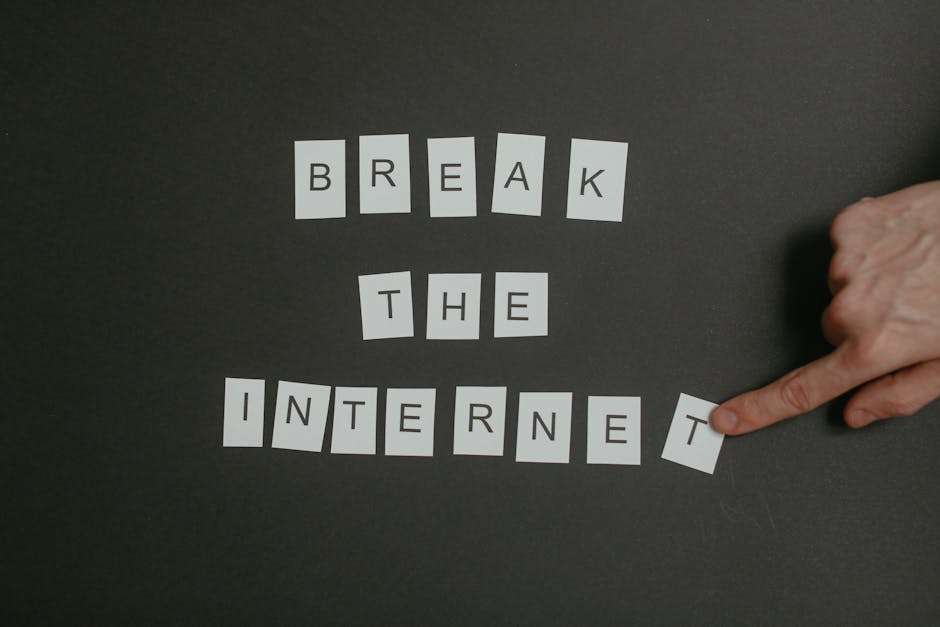 Textual phrase 'Break the Internet' arranged on a black background with a pointing hand.