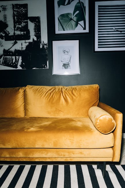 maximalist living room velvet sofa jewel tones gallery wall